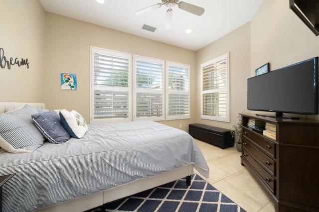 tiled bedroom featuring ceiling fan