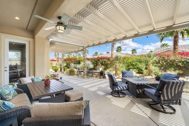 view of patio / terrace featuring an outdoor living space with a fire pit, ceiling fan, and a pergola