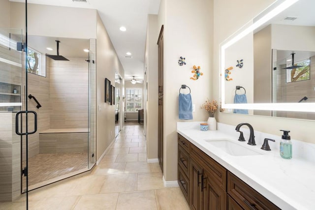 bathroom featuring vanity, an enclosed shower, and tile patterned flooring