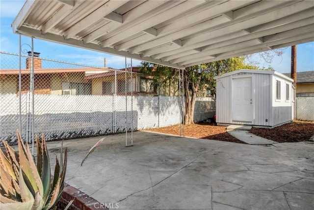 view of patio featuring a storage unit