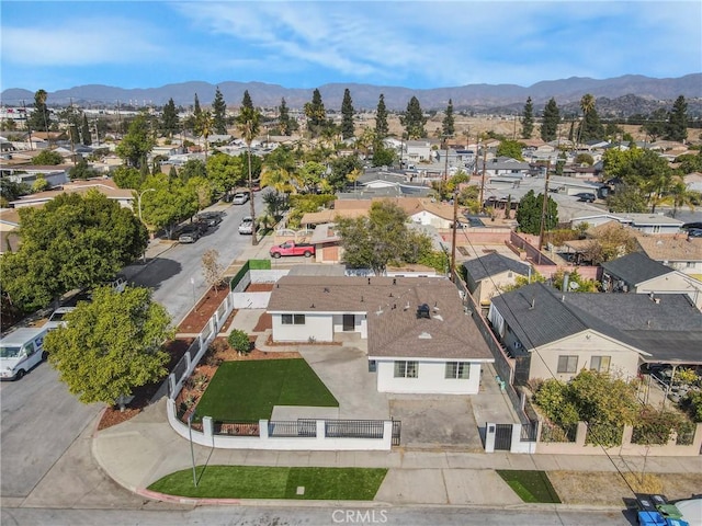 birds eye view of property featuring a mountain view