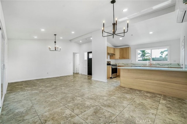 kitchen with vaulted ceiling, a chandelier, hanging light fixtures, light tile patterned floors, and stainless steel range oven