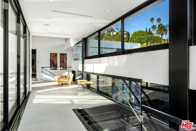 corridor with floor to ceiling windows