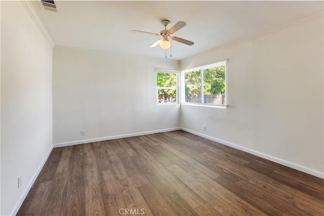 empty room featuring hardwood / wood-style floors and ceiling fan