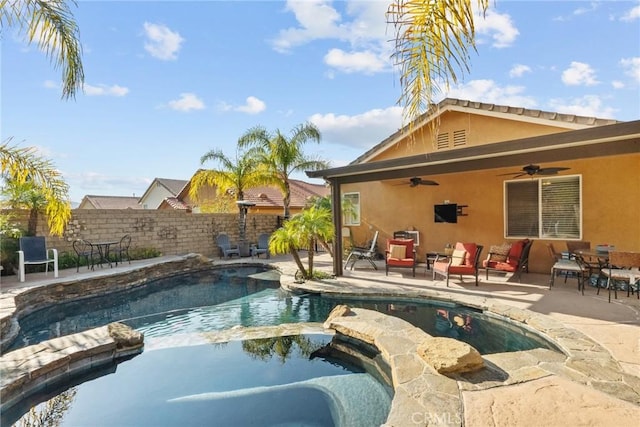 view of swimming pool featuring a patio, ceiling fan, and an in ground hot tub