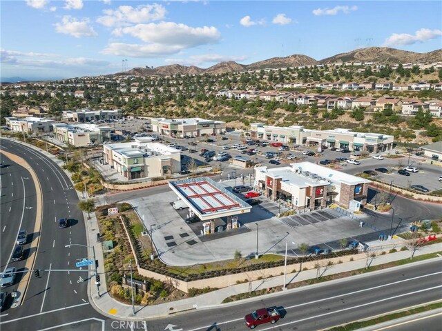 birds eye view of property with a mountain view