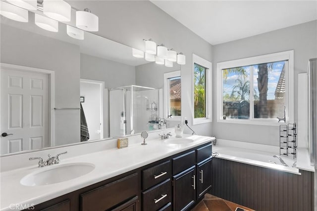 bathroom featuring vanity, tile patterned flooring, and shower with separate bathtub