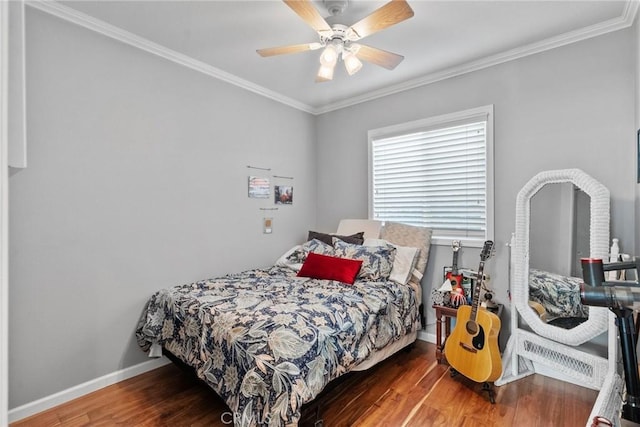 bedroom featuring hardwood / wood-style floors, ornamental molding, and ceiling fan