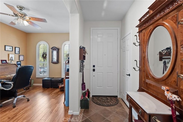 foyer with hardwood / wood-style flooring and ceiling fan