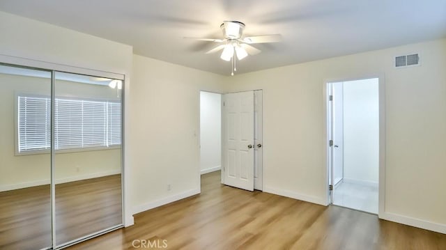 unfurnished bedroom with a closet, ceiling fan, and light hardwood / wood-style flooring