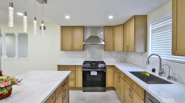 kitchen with tasteful backsplash, sink, hanging light fixtures, stainless steel appliances, and wall chimney range hood