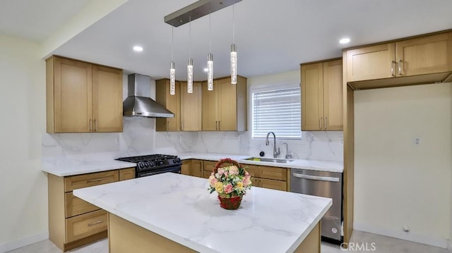 kitchen with wall chimney range hood, sink, dishwasher, a kitchen island, and black range with gas stovetop