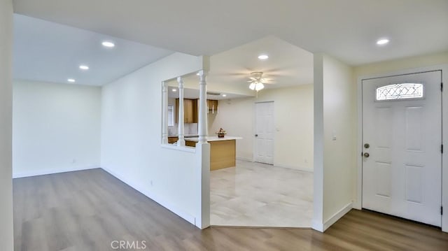 entrance foyer with ceiling fan and light hardwood / wood-style floors