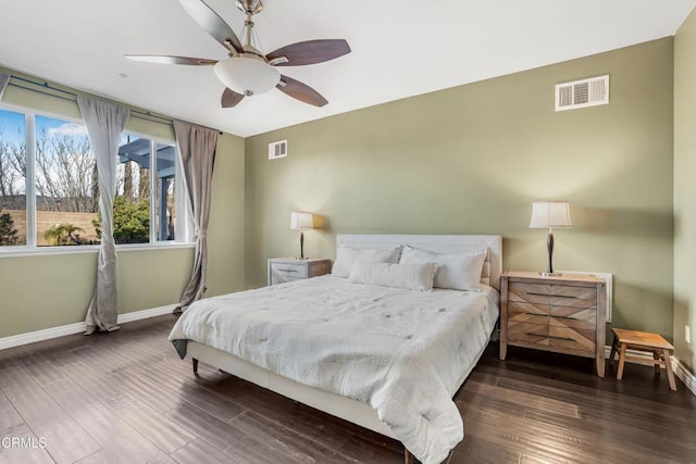 bedroom featuring ceiling fan and dark hardwood / wood-style flooring