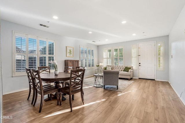 dining space featuring light wood-type flooring