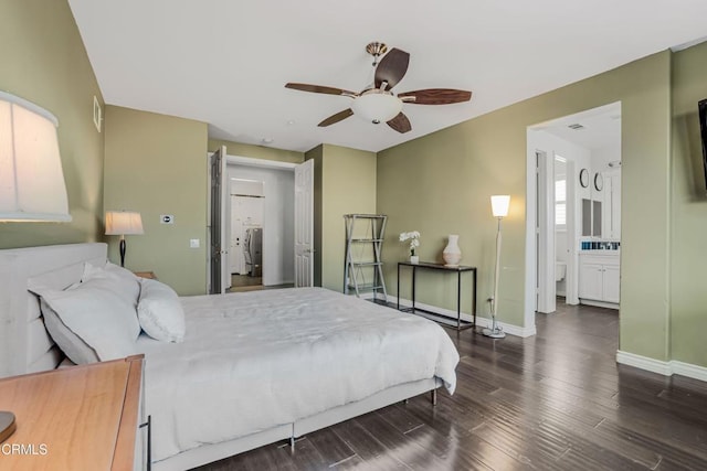 bedroom featuring ceiling fan, ensuite bath, and dark hardwood / wood-style flooring