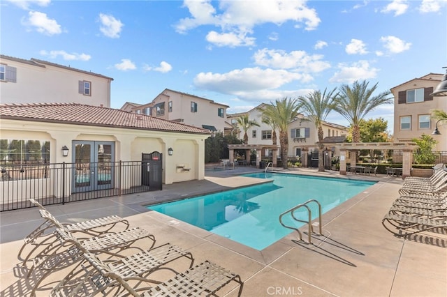 view of swimming pool featuring a pergola and a patio