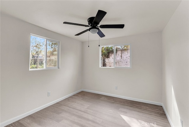 unfurnished room featuring ceiling fan and light wood-type flooring