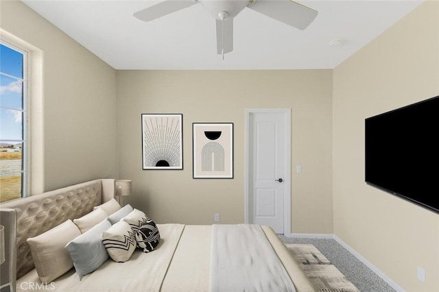 carpeted bedroom with ceiling fan