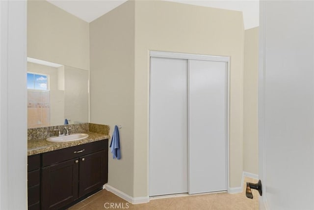 bathroom featuring vanity and tile patterned flooring