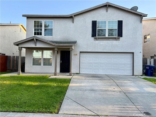 view of front property featuring a garage and a front lawn