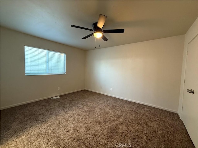 spare room with ceiling fan and carpet flooring