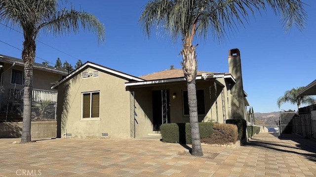 rear view of property with a patio area