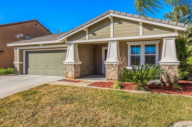 view of front of house with a garage and a front yard