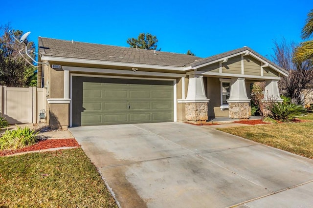 view of front of property featuring a garage and a front yard