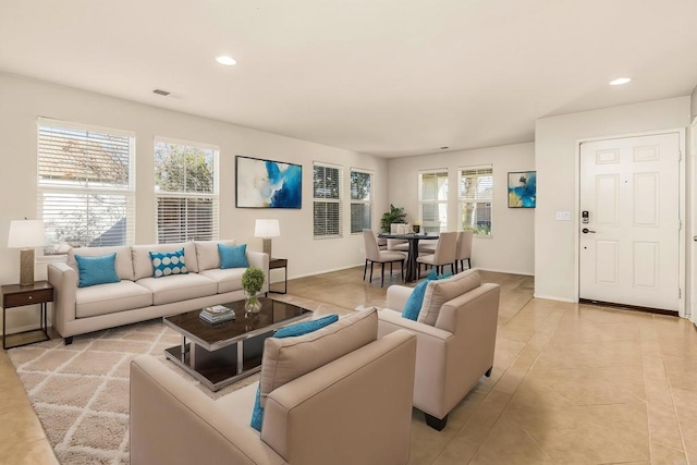 tiled living room featuring a wealth of natural light