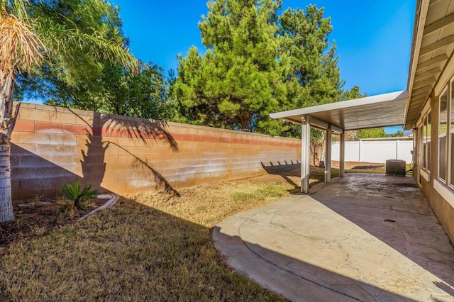 view of yard with a fenced backyard and a patio