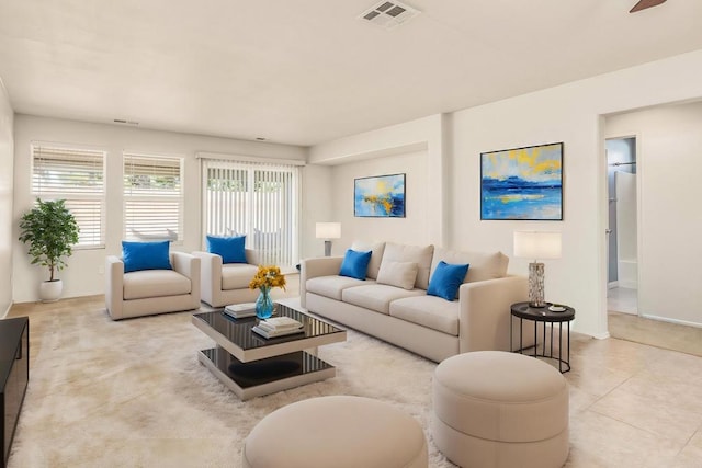 living room featuring visible vents and tile patterned floors