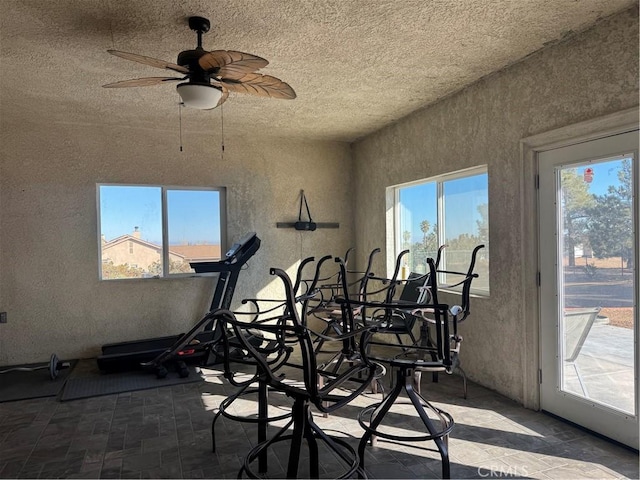 workout room with ceiling fan