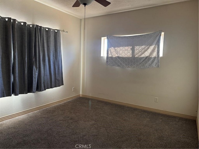 unfurnished room with ceiling fan, carpet flooring, and a textured ceiling