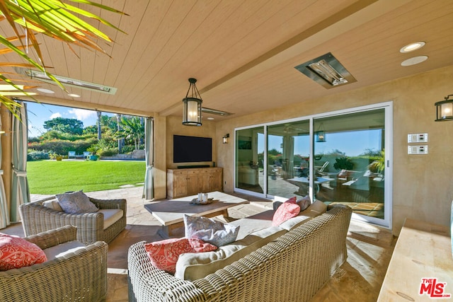 view of patio featuring outdoor lounge area and ceiling fan