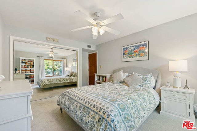 bedroom with ceiling fan and a closet