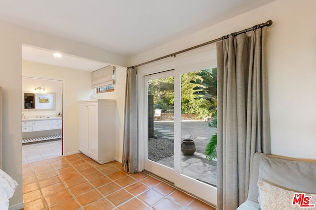 doorway featuring light tile patterned floors