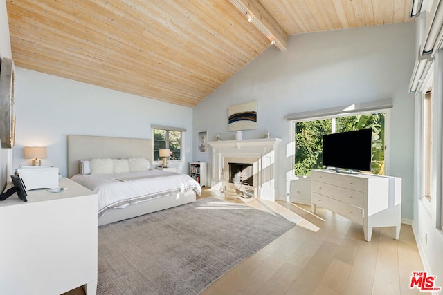 bedroom with wood ceiling, high vaulted ceiling, beam ceiling, and light hardwood / wood-style floors