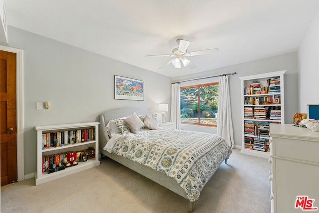 bedroom featuring ceiling fan and light colored carpet