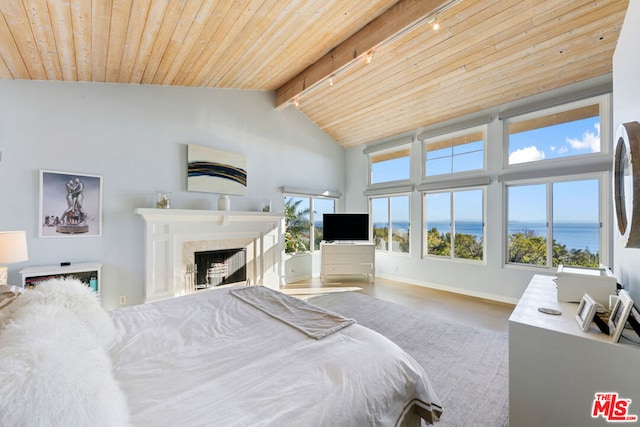 bedroom featuring high vaulted ceiling, track lighting, wooden ceiling, and beamed ceiling