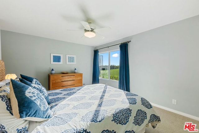 bedroom with ceiling fan and carpet flooring