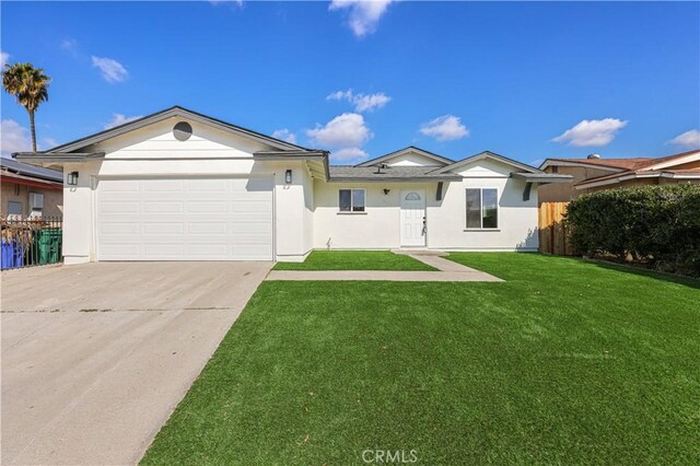 ranch-style home with a garage and a front yard