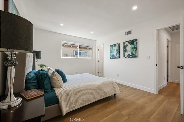 bedroom with light hardwood / wood-style floors