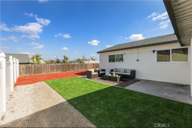 view of yard with an outdoor living space and a patio area