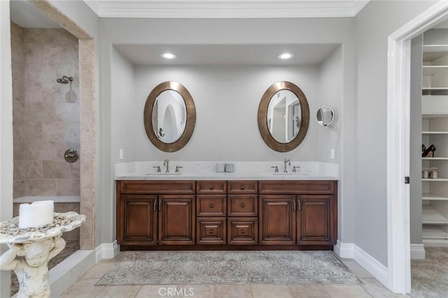 bathroom featuring crown molding, vanity, and tile patterned flooring