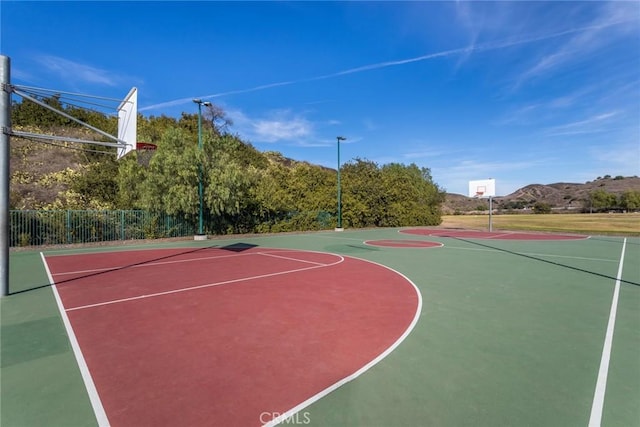 view of basketball court featuring a mountain view