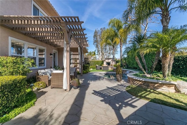 view of patio / terrace with a pergola and an outdoor living space with a fireplace