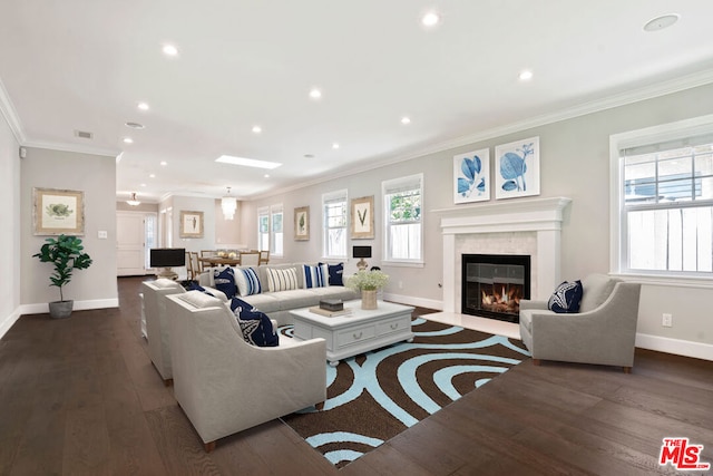 living room with crown molding and dark hardwood / wood-style flooring