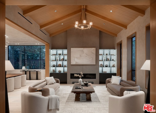 living room featuring high vaulted ceiling, a large fireplace, a notable chandelier, wood ceiling, and beam ceiling