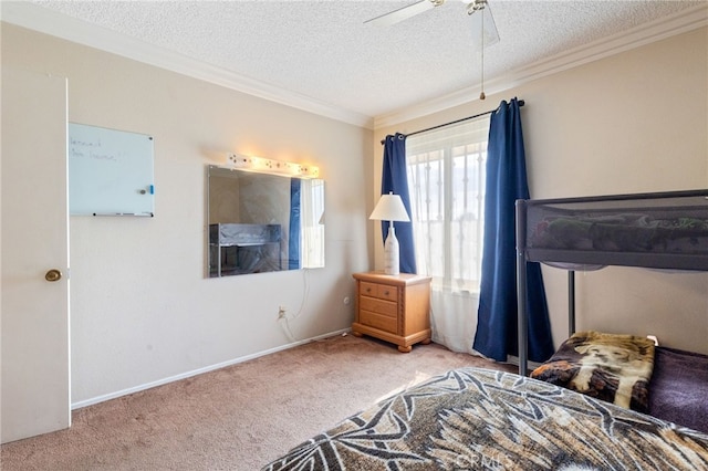 bedroom with ceiling fan, ornamental molding, light carpet, and a textured ceiling